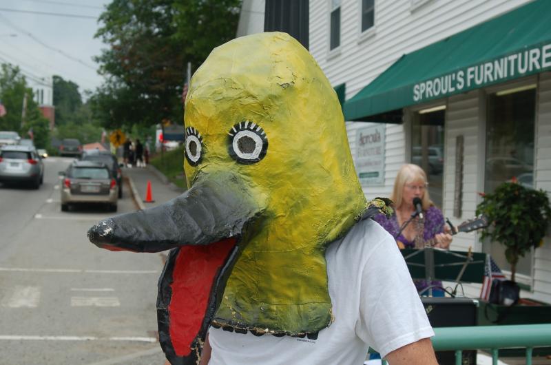 Phil Averill wears the duck mask and waves at passersby. ART MAYERS/Boothbay Register