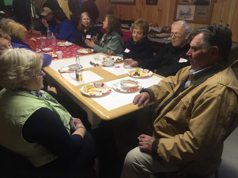 Chamber members talk in a museum building before the ride. SUSAN JOHNS/Wiscasset Newspaper