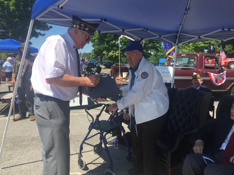 Cossette passes a certificate to World War II veteran George Jones. SUSAN JOHNS/Wiscasset Newspaper