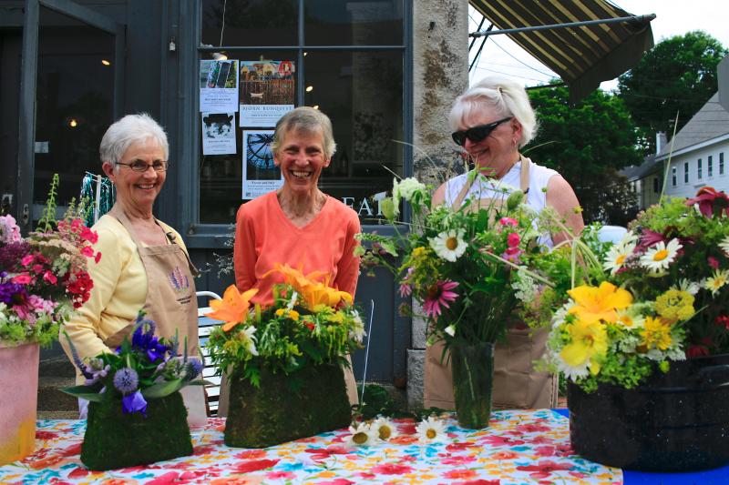 Wiscasset Garden Club members selling flower bouquets during the July Wiscasset Art Walk. Courtesy of Lucia Droby