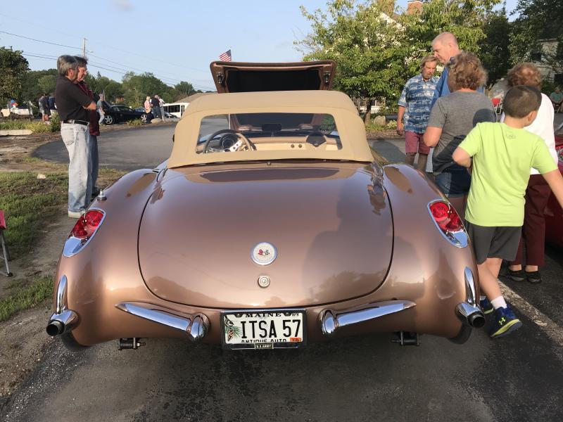 Attendees look over Robert Blum’s 1957 Corvette at the vintage car show. KELLIE BIGOS/Boothbay Register