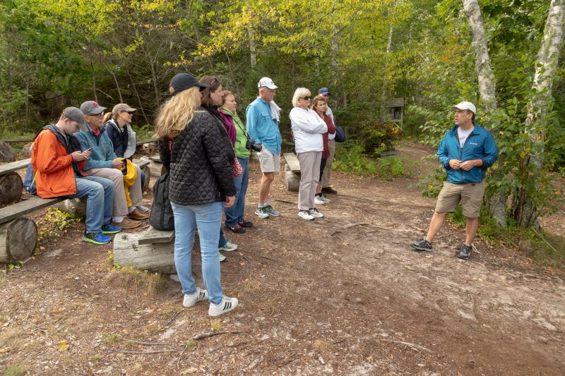 Cruise participants get a lesson on Burnt Island. Mike Leonard photo