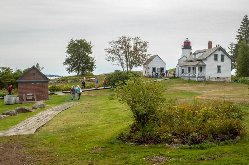 Cruise participants head toward the lighthouse on Burnt Island. Mike Leonard photo