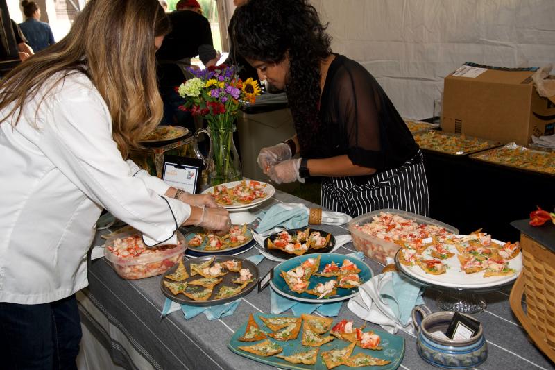Claw Down winner Dana Moos and assistant Cherie Scott setting up the tasty lobster wontons of lobster, wonton crisp, kewpie aioli, smoked butter, charred scallions and truffle oil, with a soy glaze. Bob Crink photo