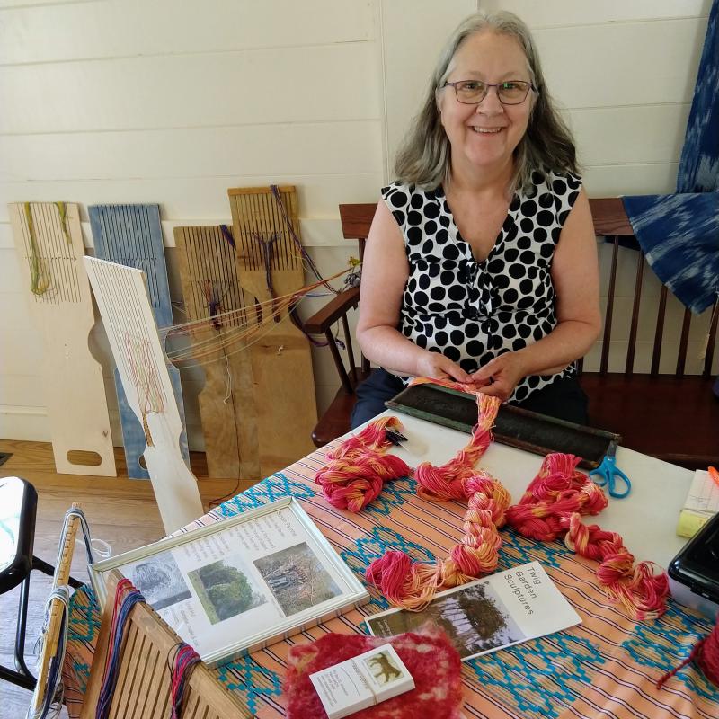 Susan Perrine prepares ikat fibers for weaving during this summer’s Artisan Days series at Boothbay Railway Village. Rori Smith photo