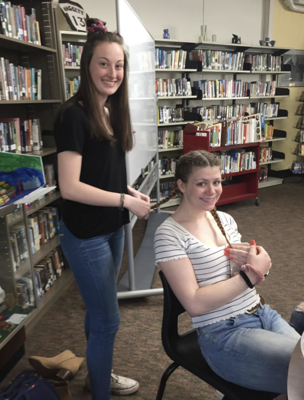 Gwen Webber helps Samantha Lakin style her hair. Courtesy of Debra Pooler