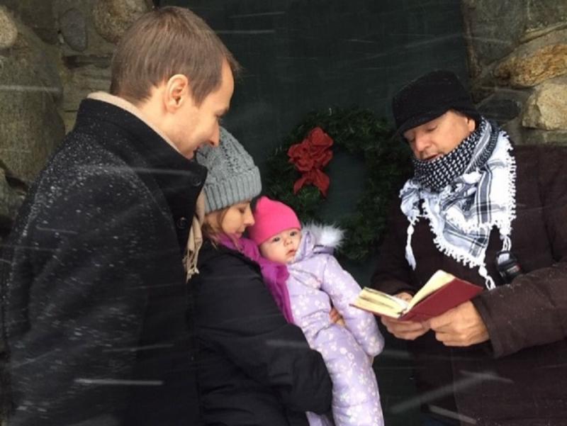 Peter Panagore conducts the baptism ceremony for 5-month-old Meredith Jones outside Wilson Memorial Chapel at Ocean Point on Dec. 30, 2019. Jill Carrick photo
