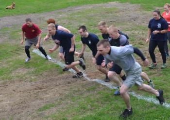 In 2014, the first heat of runners cross the starting line. Shawn St. Cyr, of Jefferson, is at the far left in a red shirt. He ran three laps, up and down Ragged Mountain, in total, 15K, including all of the obstacles of the annual Run For Your Life Emergency Service Challenge. (Photo by Lynda Clancy)
