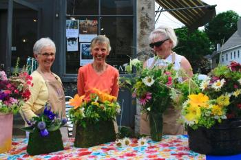 Wiscasset Garden Club members selling flower bouquets during the July Wiscasset Art Walk. Courtesy of Lucia Droby