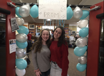 Leah Labelle and Kayla Cossette stand in front of the entrance to Prepping for Prom. Courtesy of Debra Pooler