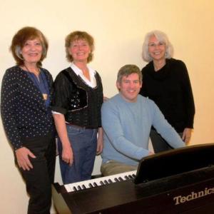 Hearts Ever Young fundraising team members, standing from left, Carol Cirigliano, choreographer; Carol Teel, artistic director/producer; Carolyn Maunz, assistant producer. Seated is Sean Fleming, music director. Courtesy of HEY