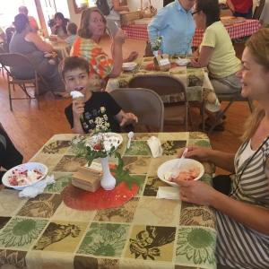 Aidan Drage, left, brother Ronan Drage and their mother Tanya Hammond enjoy St. Philip’s Episcopal Church’s strawberry festival June 25. SUSAN JOHNS/Wiscasset Newspaper
